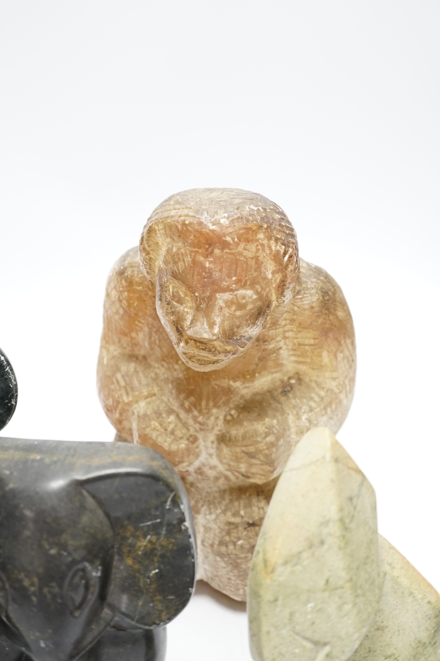 Six soapstone and marble carvings of Inuit figures, elephants, an Egyptian style cat, etc. tallest 22.5cm